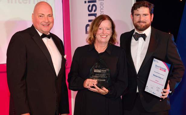 Presenter and Christine and Josh from Wessex Internet at Dorset Business Awards 2023