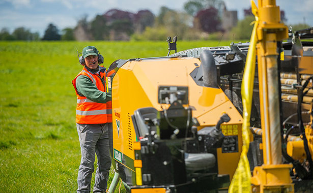 Wessex Internet staff member operating a drill.