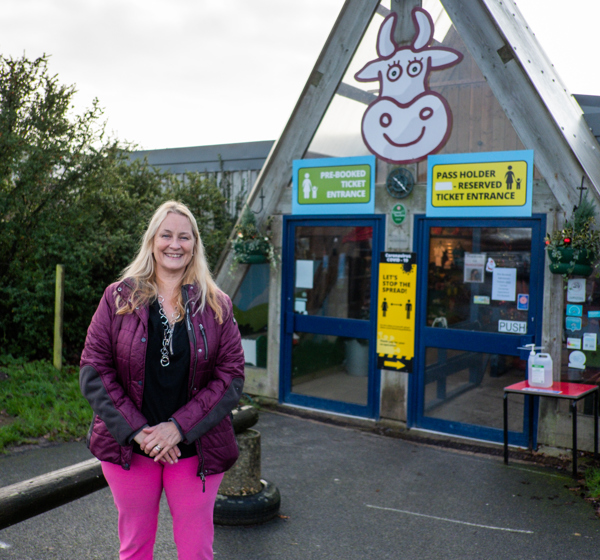 Lady in front of Farmer Palmers entrance