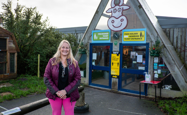 Lady in front of Farmer Palmers entrance