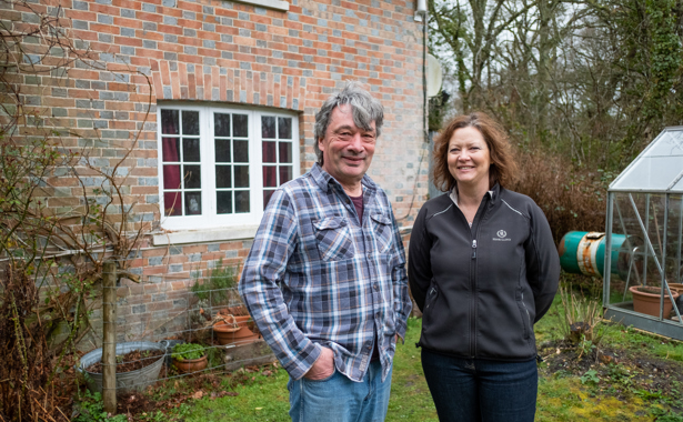 Gary And Morag Warr in front of property